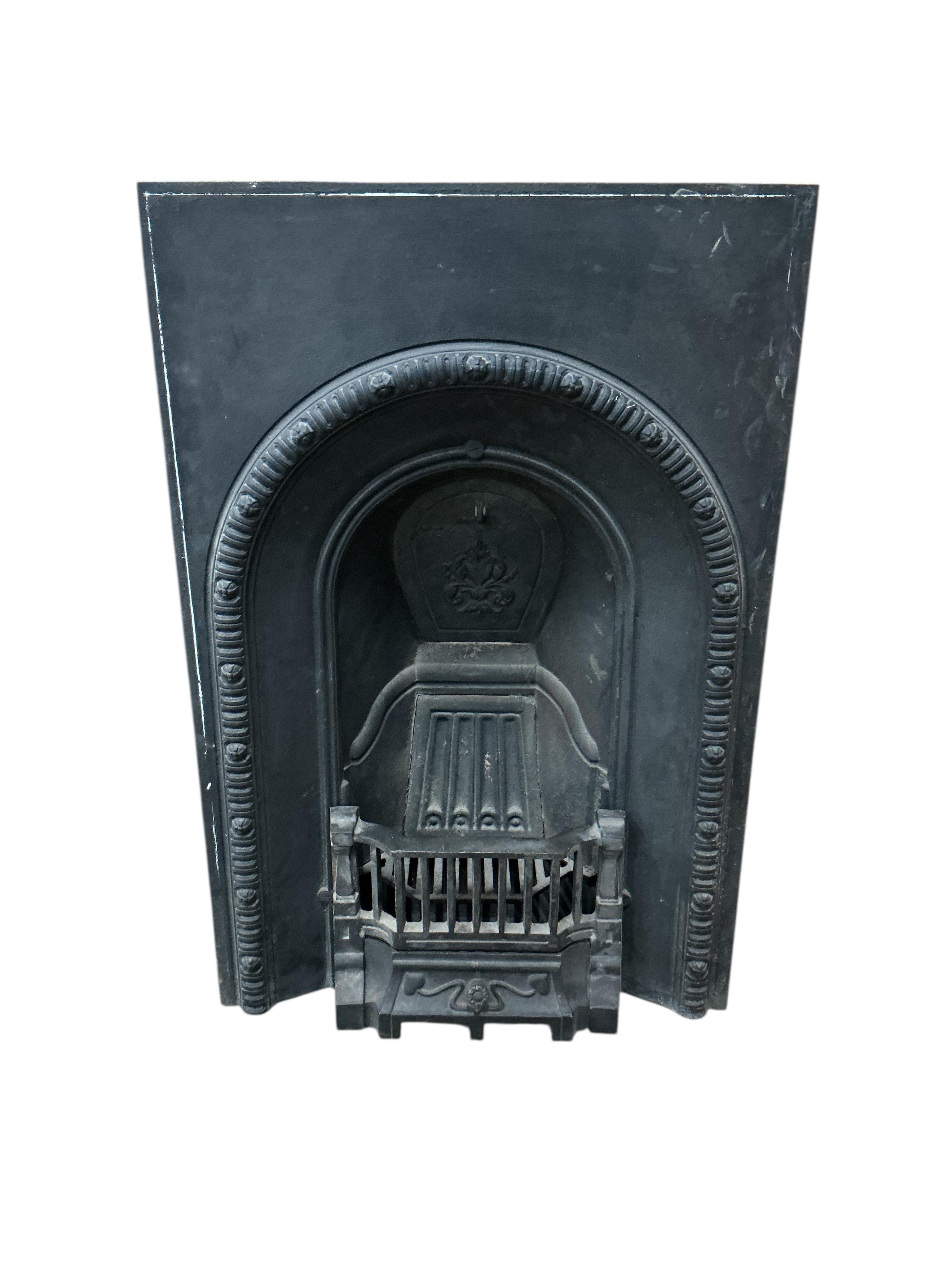 A Victorian cast iron fireplace, width 61cm, height 92cm